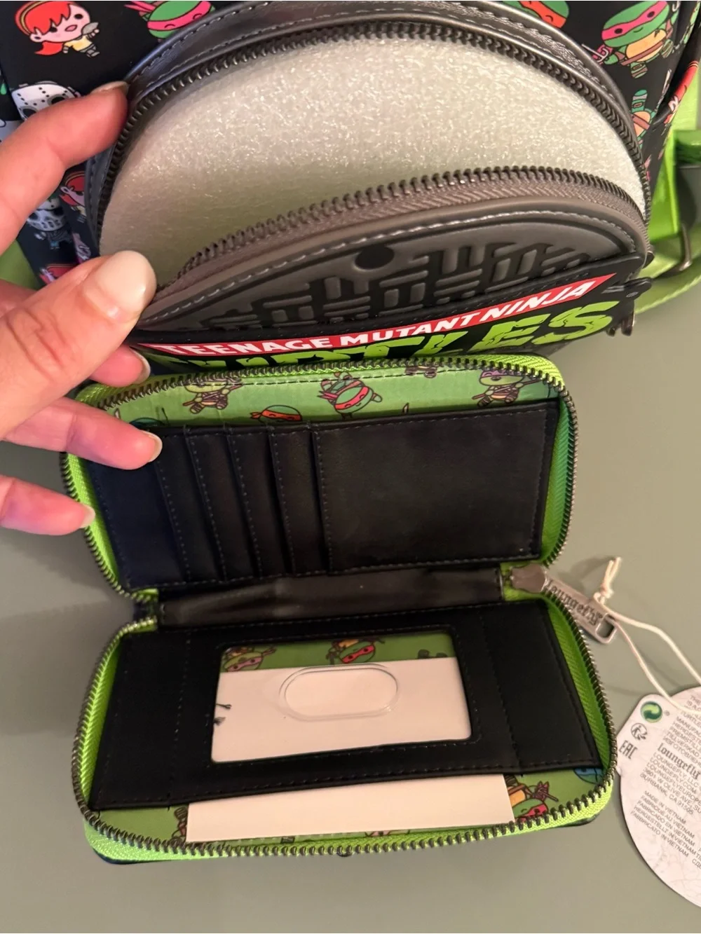 Loungefly: Teenage Mutant Ninja Turtles Sewer Cap AOP Mini Backpack and Wallet